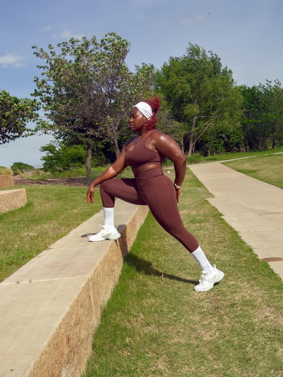 Woman doing lunges outdoors